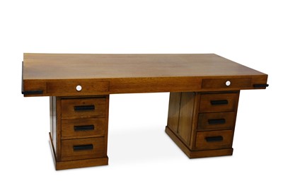 Lot 685 - A large Art Deco oak desk, the rectangular top...