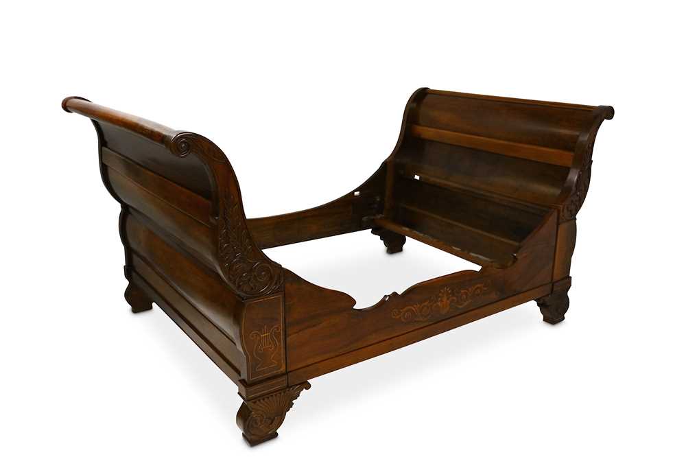 Lot 687 - A 19th Century French cherrywood bateau en lit...