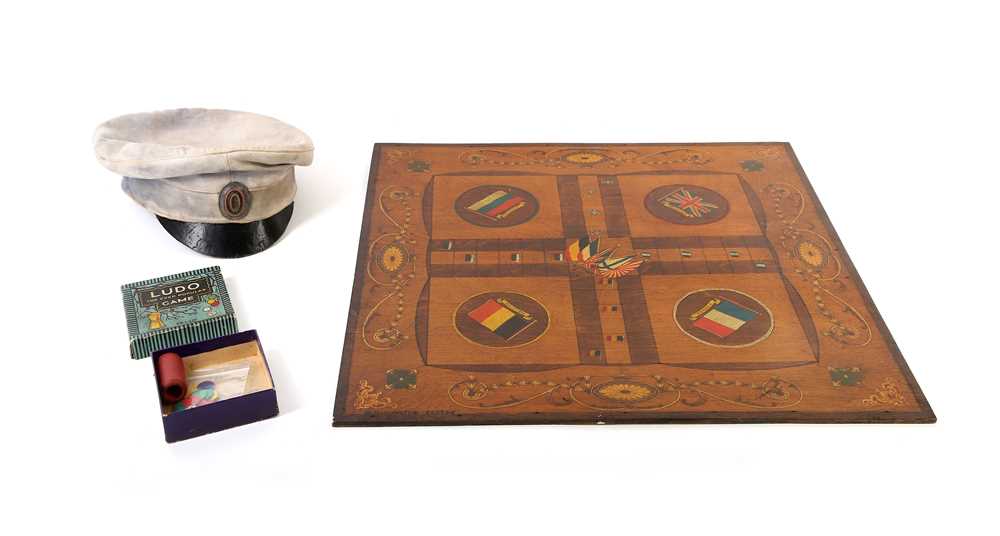 Lot 26 - A WW1 era Ludo board in thin wood, with...