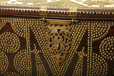 Lot 57 - A TEAK AND BRASS STUDDED ZANZIBAR CHEST. With...