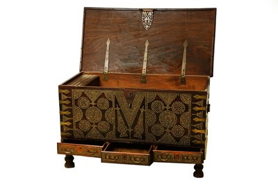 Lot 57 - A TEAK AND BRASS STUDDED ZANZIBAR CHEST. With...