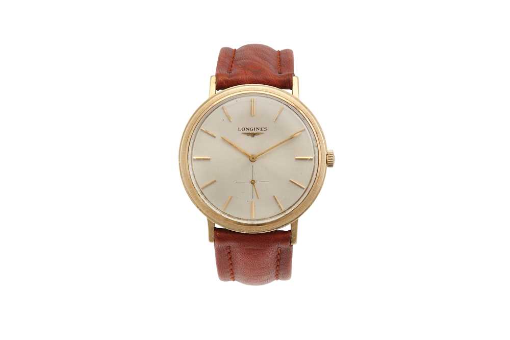 Lot 294 - LONGINES. A GENTS 14K YELLOW GOLD MANUAL WIND...