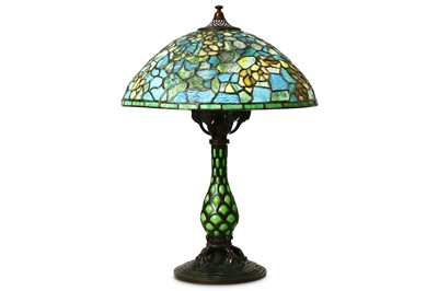 Lot 32 - A TIFFANY STYLE BRONZE TABLE LAMP. With a blue...