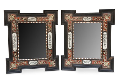 Lot 98 - A PAIR OF ITALIAN EBONISED WALL MIRRORS. The...