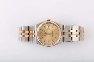 Lot 310 - ROLEX. A  GENTS STAINLESS STEEL AND GOLD...