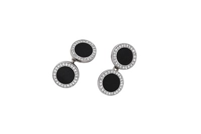 Lot 25 - A pair of onyx and diamond cufflinks, first...
