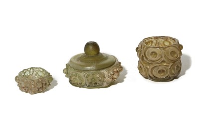 Lot 177 - THREE GREEN GLASS PYXIDES Circa 11th Century A....