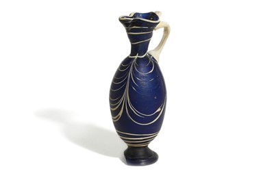 Lot 175 - A BLUE GLASS OINOCHOE After the antique, the...