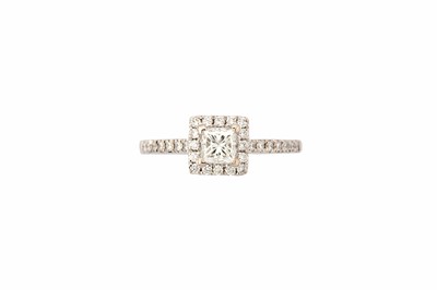 Lot 764 - A diamond cluster ring, set with a...