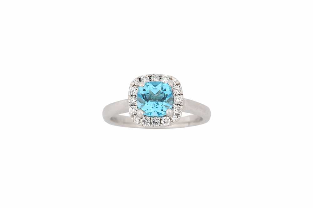 Lot 767 - A blue topaz and diamond cluster ring, set