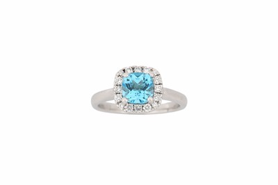 Lot 767 - A blue topaz and diamond cluster ring, set...