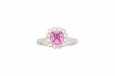 Lot 768 - A pink sapphire and diamond cluster ring, set...