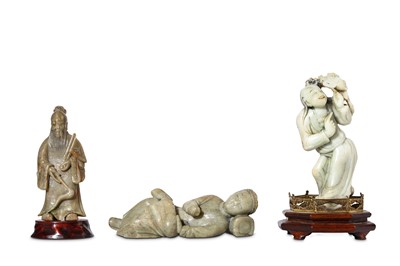 Lot 265 - THREE CHINESE SOAPSTONE FIGURES. Qing Dynasty....