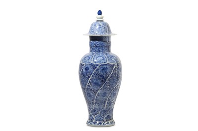 Lot 28 - A CHINESE BLUE AND WHITE VASE AND COVER. Qing...