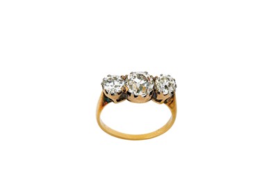 Lot 187 - A diamond three-stone ring Set with a...