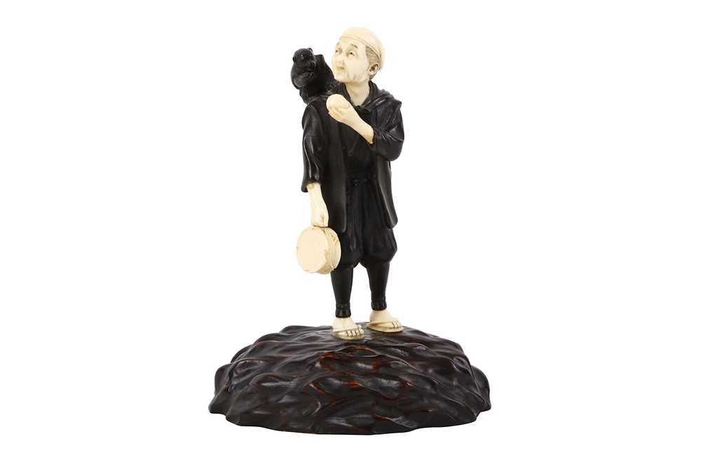 Lot 187 - A JAPANESE BRONZE AND IVORY FIGURE OF A MONKEY...
