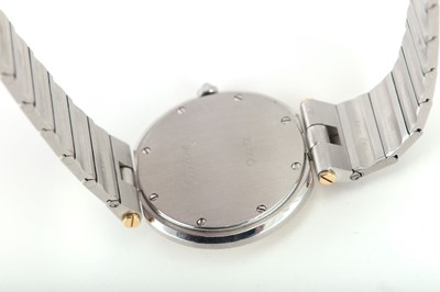 Lot 267 - CARTIER. A STAINLESS STEEL AND GOLD QUARTZ...