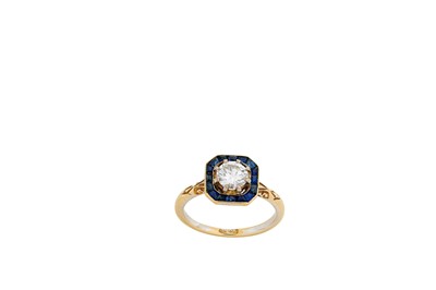 Lot 203 - A sapphire and diamond cluster ring The...