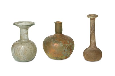 Lot 152 - THREE ROMAN GLASS FLASKS Circa 2nd - 4th...