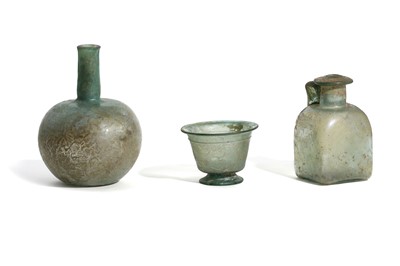 Lot 151 - THREE ROMAN PALE BLUE GLASS VESSELS Circa 4th -...