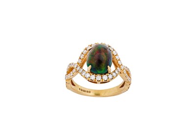 Lot 132 - A black opal and diamond ring The central oval...