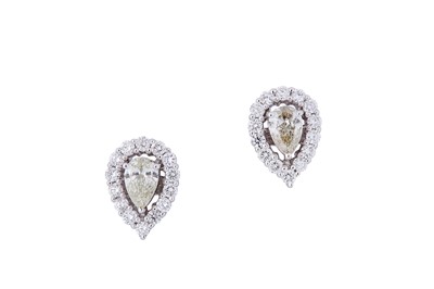 Lot 52 - A pair of diamond cluster earrings Each set to...