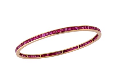 Lot 37 - A ruby bangle Set with a continuous row of...