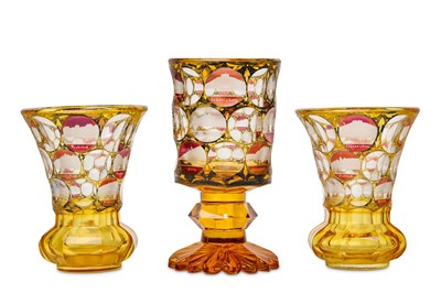 Lot 42 - A PAIR OF BOHEMIAN AMBER-STAINED GLASS BEAKERS...