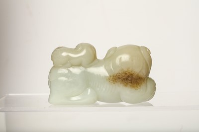 Lot 57 - A CHINESE JADE ‘LION AND CUB’ CARVING. Seated...