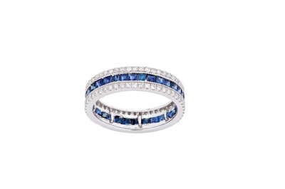 Lot 185 - A sapphire and diamond eternity ring The...