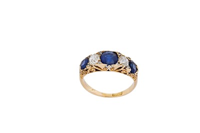 Lot 89 - A sapphire and diamond ring, circa 1890 Set...