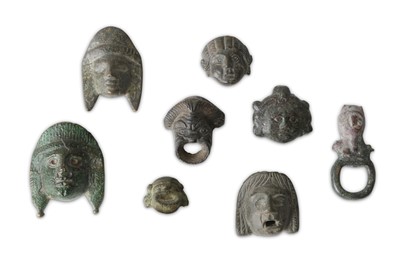 Lot 116 - A GROUP OF ROMAN BRONZE THEATRE MASK...