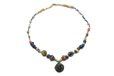 Lot 108 - A ROMANO-EGYPTIAN BEADED NECKLACE Restrung,...