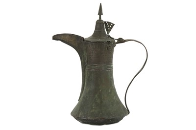 Lot 104 - A MONUMENTAL OMANI COFFEE POT Oman, late 19th/...