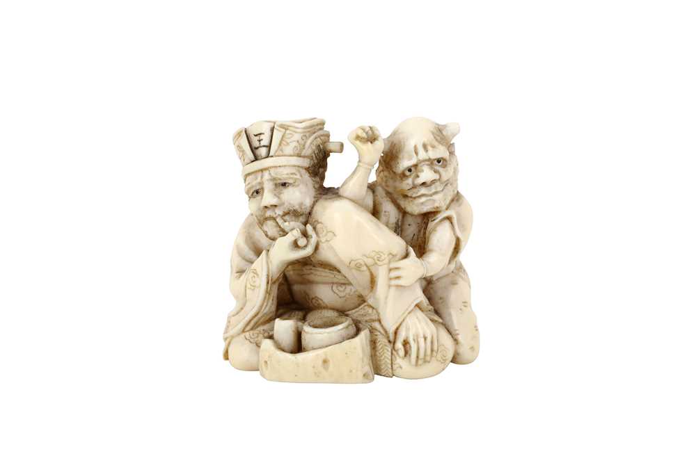 Lot 179 - A JAPANESE IVORY NETSUKE OF SHOKI AND DEMON....