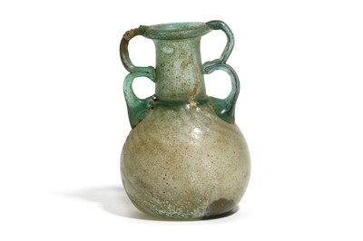 Lot 165 - A ROMAN GLASS BOTTLE Circa 3rd - 4th Century A....