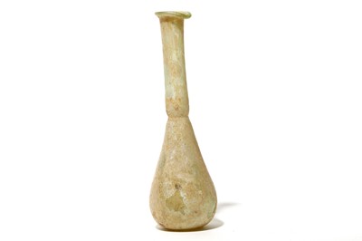 Lot 158 - A ROMAN GREEN GLASS UNGUENTARIUM Circa 3rd -...