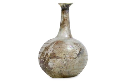 Lot 146 - A ROMAN GREEN GLASS FLASK Circa 1st Century...