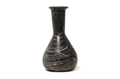 Lot 144 - A ROMAN AUBERGINE MARBLED GLASS FLASK Circa...