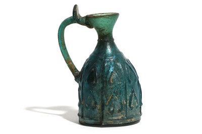 Lot 179 - A BLUE MOULD-BLOWN GLASS FLASK Islamic Period,...