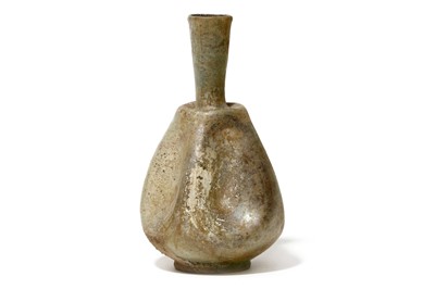 Lot 169 - A ROMAN PALE GREEN GLASS FLASK Circa 1st - 3rd...