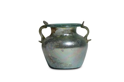 Lot 124 - A ROMAN GREEN GLASS JUG Circa 3rd Century A.D....