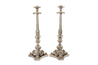 Lot 592 - A pair of Victorian silver plated candlesticks,...