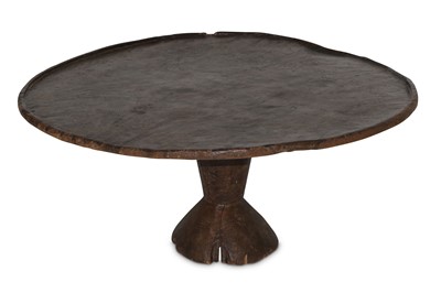 Lot 182 - A circular African low table.