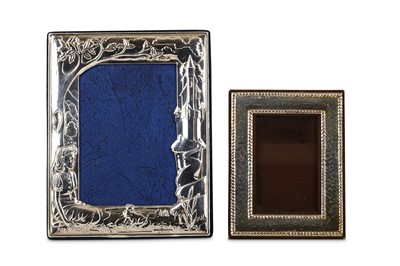 Lot 65 - A silver photograph frame, embossed with a...