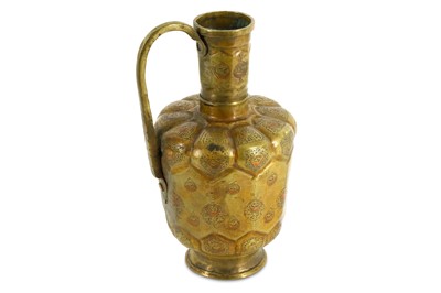 Lot 41 - A KHORASSANI COPPER-INLAID BRASS EWER Iran,...