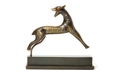 Lot 31 - A SILVER AND COPPER-INLAID BRASS GAZELLE Iran,...