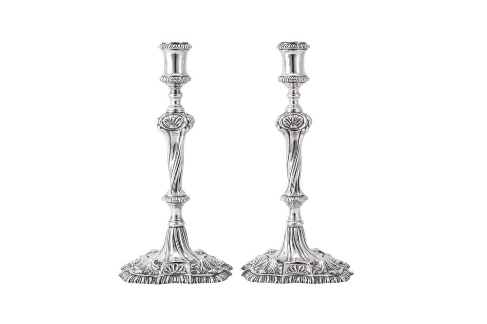 Lot 119 - A pair of George III Irish cast sterling silver candlesticks, Dublin circa 1765-70 by Richard Williams