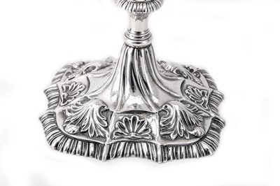 Lot 119 - A pair of George III Irish cast sterling silver candlesticks, Dublin circa 1765-70 by Richard Williams