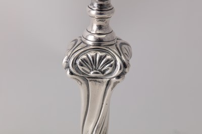 Lot 119 - A pair of George III Irish cast sterling silver candlesticks, Dublin circa 1765-70 by Richard Williams